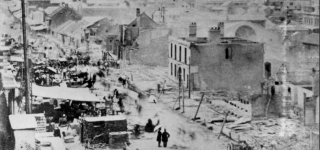 Queen Street, Brisbane, Queensland after the fire in December 1864.png