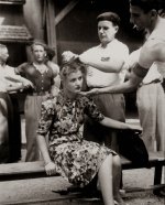 A French woman has her head shaved by civilians as a penalty for having consorted with German ...jpg