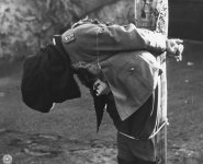 German General Anton Dostler is tied to a stake before his execution by a firing squad, Italy,...jpg